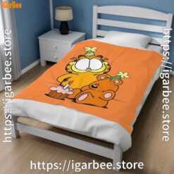 2 happy birthday garfield with small cake orange blanket