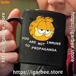 garfield you are not immune to propaganda black coffee mug