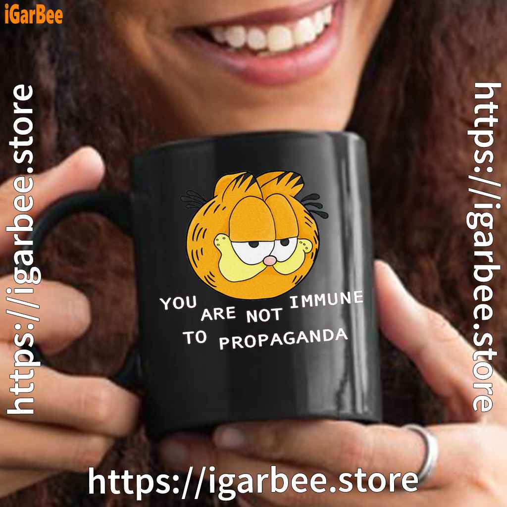 garfield you are not immune to propaganda black mug garfield you are not immune to propaganda black mug