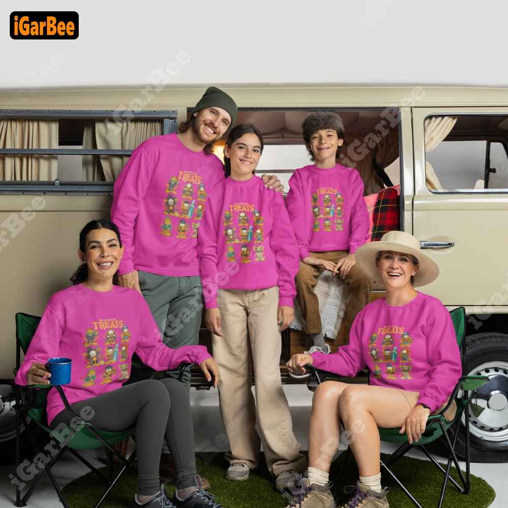 Little girl in a pink Garfield sweatshirt, size S, happily camping with her family.